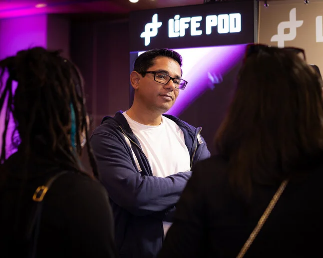 Conversations at the Life Pod stand during the show