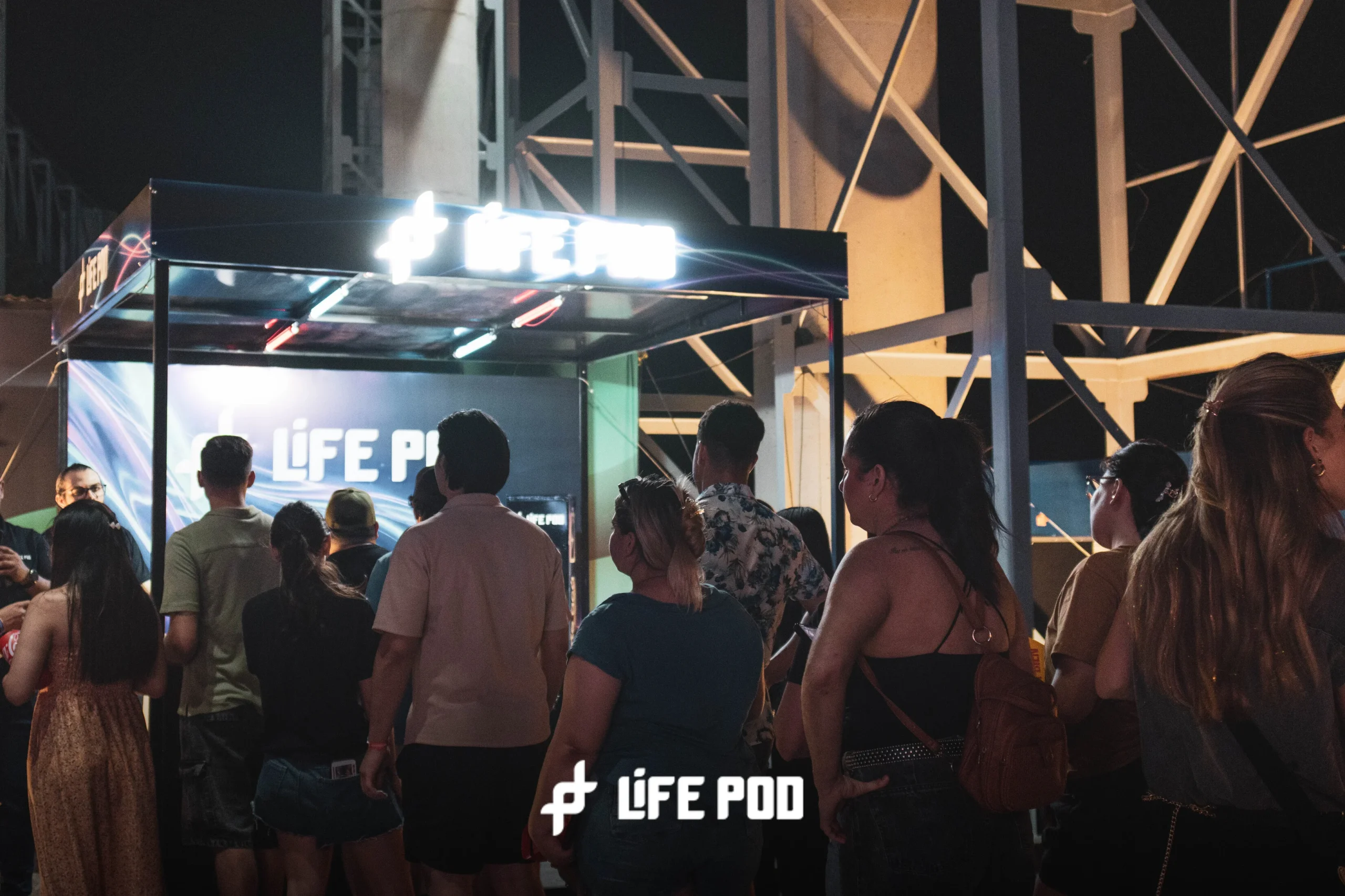 Life Pod stand at Reciclarte 2026 festival in Paraguay at night